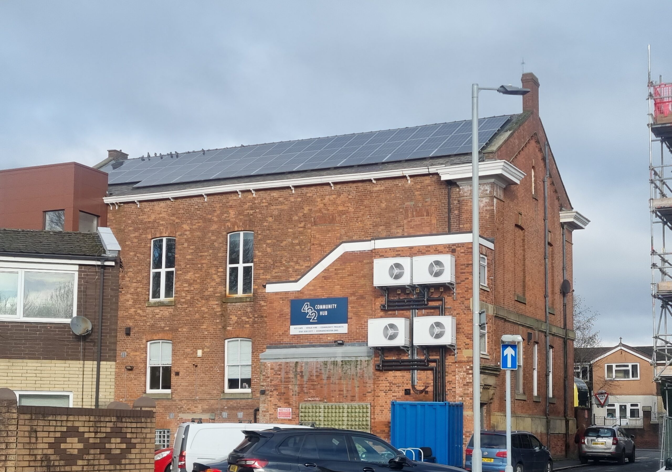 A community Building with solar panels and heat pumps